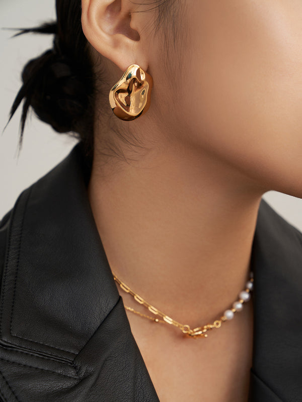 Asymmetric exaggerated earrings