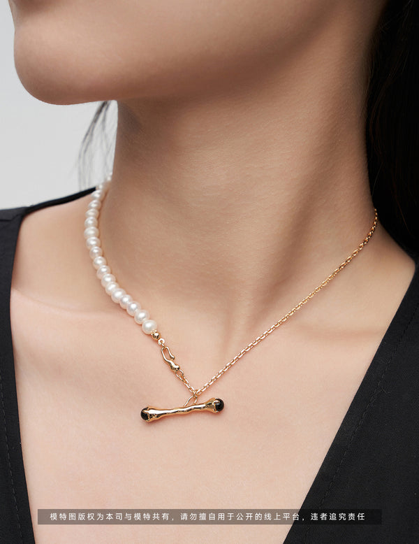 Branches and pearl necklace